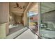 View of the covered patio with a ceiling fan and sliding doors to backyard at 2345 Hot Brook Point St, Las Vegas, NV 89134