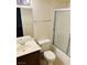 Standard bathroom featuring a single sink vanity, toilet, and shower with a sliding glass door at 2724 Otter Creek Ct # 101, Las Vegas, NV 89117
