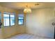 Dining area with tile floors and natural light from two windows at 2724 Otter Creek Ct # 101, Las Vegas, NV 89117