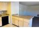 Neutral kitchen features granite countertops, and white cabinets at 2724 Otter Creek Ct # 101, Las Vegas, NV 89117
