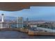 Expansive balcony offers stunning cityscape views, perfect for relaxing or entertaining, as the sun sets at 2777 Paradise Rd # Ph 3001, Las Vegas, NV 89109