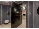 Modern condo entryway featuring a large door, textured walls, and a glimpse into the living space at 2777 Paradise Rd # Ph 3001, Las Vegas, NV 89109