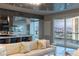 Cozy living room open to the kitchen and dining area with a spectacular city view and balcony access at 2777 Paradise Rd # Ph 3001, Las Vegas, NV 89109