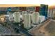 Striking aerial view of high-rise condos with city skyline and desert mountains in the background at 2857 Paradise Rd # 601, Las Vegas, NV 89109