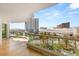 Wide balcony featuring city views, palm trees, and patio furniture at 2857 Paradise Rd # 601, Las Vegas, NV 89109