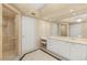 Elegant bathroom with a glass-enclosed shower and vanity with storage at 2857 Paradise Rd # 601, Las Vegas, NV 89109