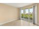 Vacant bedroom features tile flooring and sliding glass doors with balcony access at 2857 Paradise Rd # 601, Las Vegas, NV 89109