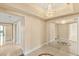 Hallway with a decorative chandelier, mirrored closet doors, and marble flooring at 2857 Paradise Rd # 601, Las Vegas, NV 89109
