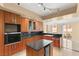 Modern kitchen with wood cabinets, granite countertops, and stainless steel appliances at 2857 Paradise Rd # 601, Las Vegas, NV 89109