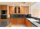 Bright kitchen featuring wooden cabinets, stainless steel appliances, and granite countertops at 2857 Paradise Rd # 601, Las Vegas, NV 89109