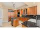 Modern kitchen with stainless steel appliances, granite countertops, and wood cabinets at 2857 Paradise Rd # 601, Las Vegas, NV 89109