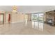 Expansive living room with tile flooring, fireplace, chandelier, and access to other rooms at 2857 Paradise Rd # 601, Las Vegas, NV 89109