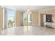 Bright and airy living room with fireplace, marble floors, chandelier, and city views at 2857 Paradise Rd # 601, Las Vegas, NV 89109