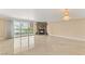 Spacious living room with marble fireplace, chandelier, tile flooring, and balcony access at 2857 Paradise Rd # 601, Las Vegas, NV 89109
