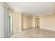 Open living area with neutral walls, marble floors, and access to balcony at 2857 Paradise Rd # 601, Las Vegas, NV 89109