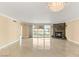 Open living room showcasing tile flooring, a marble fireplace, chandelier, and a bright balcony at 2857 Paradise Rd # 601, Las Vegas, NV 89109