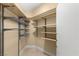 Organized walk-in closet with built-in shelving and hanging rods for storage at 2857 Paradise Rd # 601, Las Vegas, NV 89109