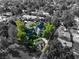 Aerial view of a home featuring landscaped yard with trees, hardscape and a circular driveway at 3001 Astoria Pines Cir, Las Vegas, NV 89107