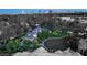 An estate home with manicured lawns, lush greenery, and a circular driveway offers privacy and style at 3001 Astoria Pines Cir, Las Vegas, NV 89107