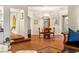 Elegant dining room featuring hardwood floors, arched doorways, and a stylish chandelier at 3001 Astoria Pines Cir, Las Vegas, NV 89107