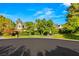 Attractive two-story home with lovely landscaping, mature trees, and a well manicured lawn at 3001 Astoria Pines Cir, Las Vegas, NV 89107