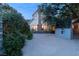 Charming home with lush landscaping, a brick chimney, and a paved driveway at 3001 Astoria Pines Cir, Las Vegas, NV 89107
