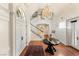 Elegant foyer with hardwood floors, chandelier, staircase, and white trim throughout at 3001 Astoria Pines Cir, Las Vegas, NV 89107
