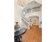 Bright foyer view with grand staircase, hardwood floors, chandelier, and elegant furnishings at 3001 Astoria Pines Cir, Las Vegas, NV 89107