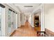 Bright hallway with french doors and view of vintage Pac Personal arcade game at 3001 Astoria Pines Cir, Las Vegas, NV 89107