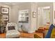 Cozy living room with a built-in bar, hardwood floors, and stylish decor at 3001 Astoria Pines Cir, Las Vegas, NV 89107