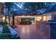 Spacious outdoor dining area with brick floors and comfortable seating for entertaining at 3001 Astoria Pines Cir, Las Vegas, NV 89107