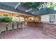 Inviting covered patio with a dining table and convenient pass-through to the home's kitchen at 3001 Astoria Pines Cir, Las Vegas, NV 89107