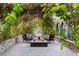 Charming outdoor lounge area featuring a stone pathway, cozy seating, and a modern fire pit at 3001 Astoria Pines Cir, Las Vegas, NV 89107