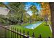Rectangular swimming pool with pristine water, surrounded by lush green turf at 3001 Astoria Pines Cir, Las Vegas, NV 89107