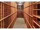 View of wine cellar with brick back wall and wooden shelving at 3001 Astoria Pines Cir, Las Vegas, NV 89107