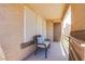 Cozy balcony with a chair and pillows, offering a relaxing outdoor space at 3455 Erva St # 219, Las Vegas, NV 89117