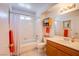 Well-lit bathroom boasts a shower-tub, vanity, and a window for natural light and ventilation at 3455 Erva St # 219, Las Vegas, NV 89117
