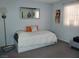 Well-lit bedroom with modern décor featuring a platform bed and a sunflower painting at 3455 Erva St # 219, Las Vegas, NV 89117