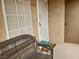 Welcoming front porch featuring a cozy wicker bench, creating an inviting outdoor space at 3455 Erva St # 219, Las Vegas, NV 89117