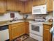 Kitchen boasting laminate countertops, white appliances, and a stainless steel sink at 3455 Erva St # 219, Las Vegas, NV 89117