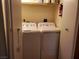 Utility closet with side-by-side washer and dryer, and shelving for storage at 3455 Erva St # 219, Las Vegas, NV 89117