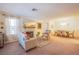 Inviting living room with a fireplace, dining area, and neutral carpet at 3455 Erva St # 219, Las Vegas, NV 89117