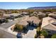 Aerial view of a neighborhood, showcasing the property's tile roof and manicured landscaping at 3459 Ridge Meadow St, Las Vegas, NV 89135