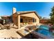 Spacious backyard featuring a pool, patio seating, and a built-in outdoor fire pit at 3459 Ridge Meadow St, Las Vegas, NV 89135