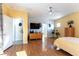 Bright bedroom featuring hardwood floors, a ceiling fan, and a full ensuite bathroom at 3459 Ridge Meadow St, Las Vegas, NV 89135