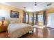 Inviting primary bedroom with hardwood floors, and large windows at 3459 Ridge Meadow St, Las Vegas, NV 89135
