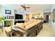 Spacious living room with modern lighting, fireplace and view of the kitchen at 3459 Ridge Meadow St, Las Vegas, NV 89135