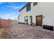Expansive backyard patio featuring brick pavers, seating, access to the house, and partial view of the pool at 4050 Peaceful Dune St, Las Vegas, NV 89129