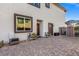 Charming home entrance with cozy seating and a well-manicured garden at 4050 Peaceful Dune St, Las Vegas, NV 89129