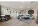 Bright living room boasts wood floors, modern decor, and comfortable seating at 4050 Peaceful Dune St, Las Vegas, NV 89129